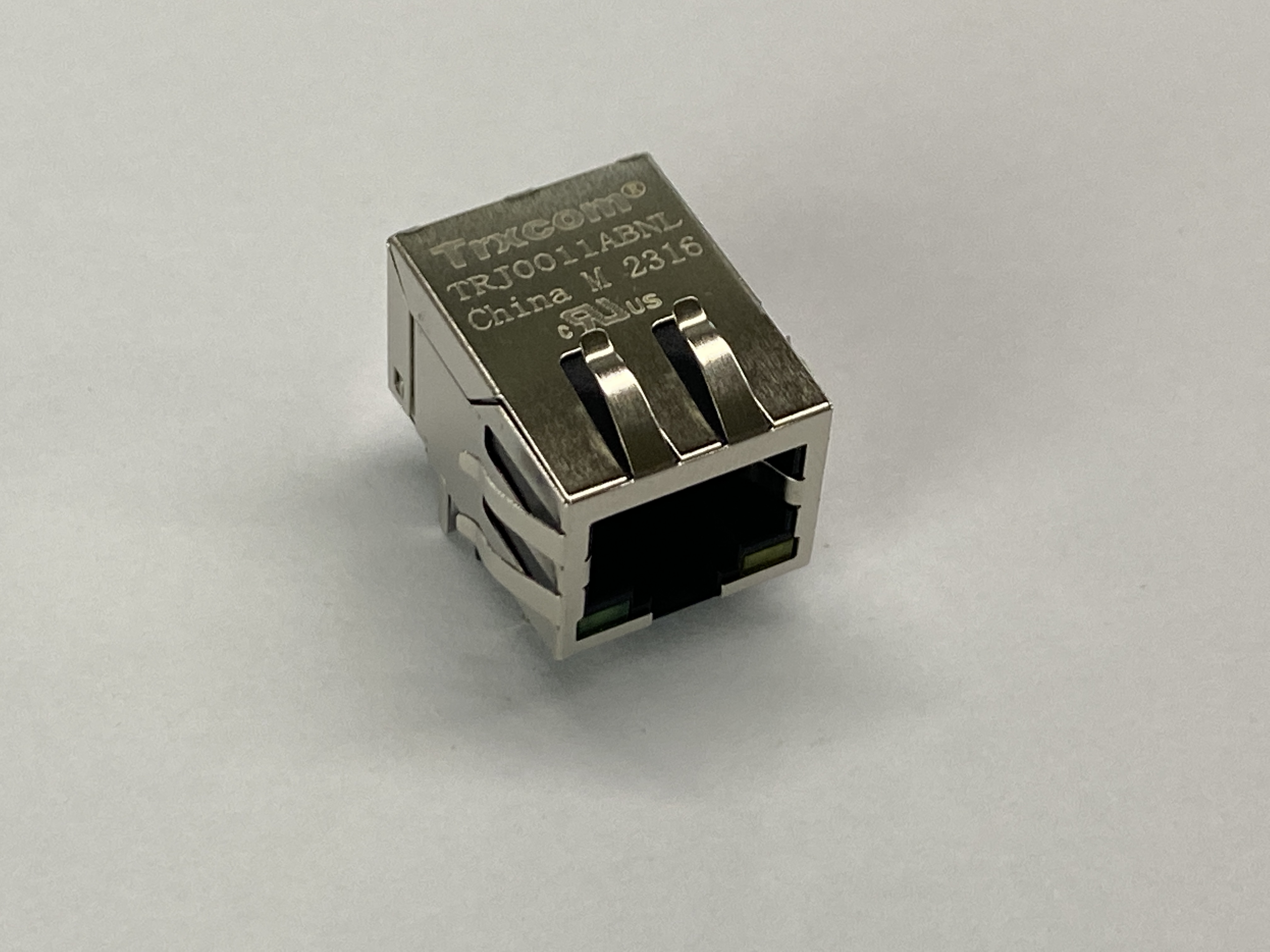 Раз-м RJ-45 10/100Base-TX, 2 св., на пл. (ан. HFJ11-2450E-L12RL*/ J0011D21BNL*) TRXCOM TRJ0011ABNL